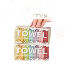 Compressed travel towels in colorful packaging.
