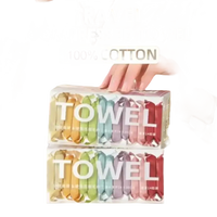 Compressed travel towels in colorful packaging.