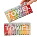 Two boxes of individually wrapped, colorful towels.