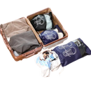 Open suitcase with packing bags.