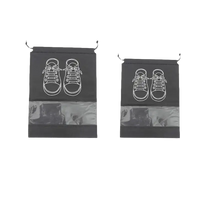 Two black shoe bags with drawstring closures.