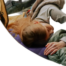 Sleeping woman in tent with campcomfort inflatable neck pillow for outdoor camping adventure