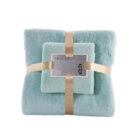 Stacked trendy coral bath set towels with ribbon, super absorbent and soft