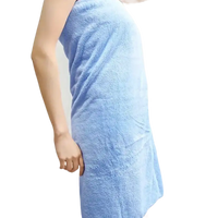 Blue towel-wrapped figure with trendy coral bath set and highly absorbent towels