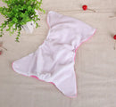 Open white cloth diaper with pink trim.