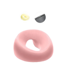 Pink donut-shaped foam beauty pillow from Ergoluxe Memory Foam for ergonomic lying