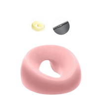 Pink donut-shaped foam beauty pillow from Ergoluxe Memory Foam for ergonomic lying