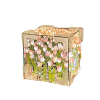 Illuminated floral cube featuring Tulip Mischief in trendy flowercube lamp design