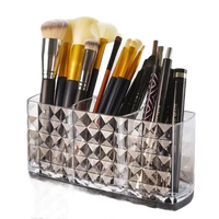Three-compartment makeup brush holder in diamond chic bathroom with patterned mirror cabinet