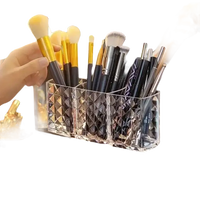 Transparent faceted makeup brush organizer in diamond chic bathroom with chic storage