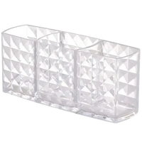 Clear faceted three-compartment organizer for trendy Diamond Chic Bathroom with patterned mirror cabinet