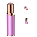 Purple and gold facial hair remover.