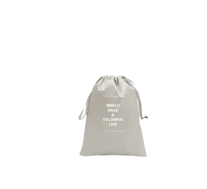 Gray drawstring bag shown as part of fake set travel organizer for storage bags