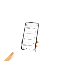 Smartphone with smart home automation app showing Tuya Bluetooth Gateway and humidity sensor for indoor climate