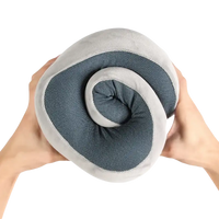 Rolled gray and blue u-comfort memory foam soft travel pillow for chill travel vibes