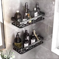 Black metal corner shower shelves with toiletries.