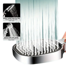 Chrome shower head with water streams.
