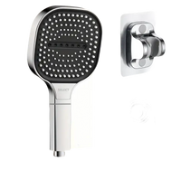 Square chrome shower head with hose and holder.