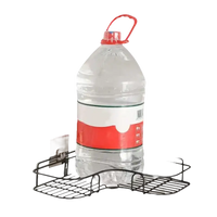 Black wire corner shelf holding a large water bottle.