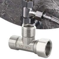 Metal plumbing T-fitting.