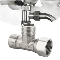 Metal plumbing T-fitting.
