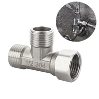 Silver metal T-fitting.