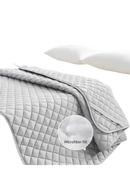 Gray quilted bedspread.
