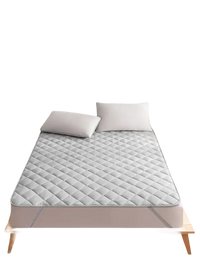 Gray quilted mattress protector.