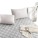 Quilted gray mattress pad.