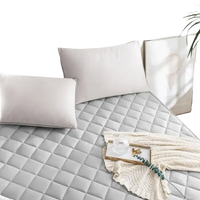 Quilted gray mattress pad.
