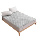 Quilted gray mattress pad.
