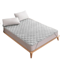 Quilted gray mattress pad.