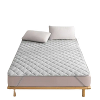 Quilted gray mattress pad.