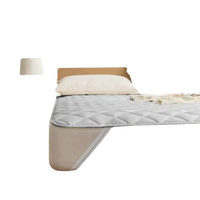 Quilted mattress topper.