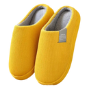 Yellow corduroy slippers with gray lining.