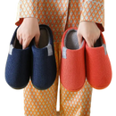 Corduroy slippers in blue and orange.