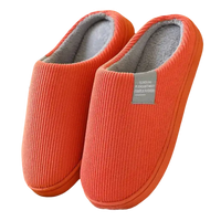 Orange corduroy slippers.