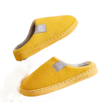 Yellow corduroy slippers.