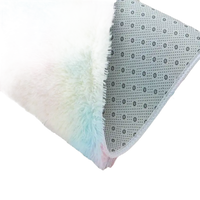 Colorful fluffy rug with non-slip backing.