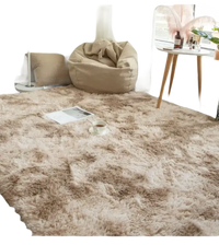 Soft, fluffy, beige rug.