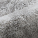 Soft, gray, shaggy fabric.