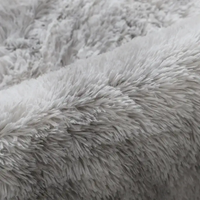 Soft, gray, shaggy fabric.