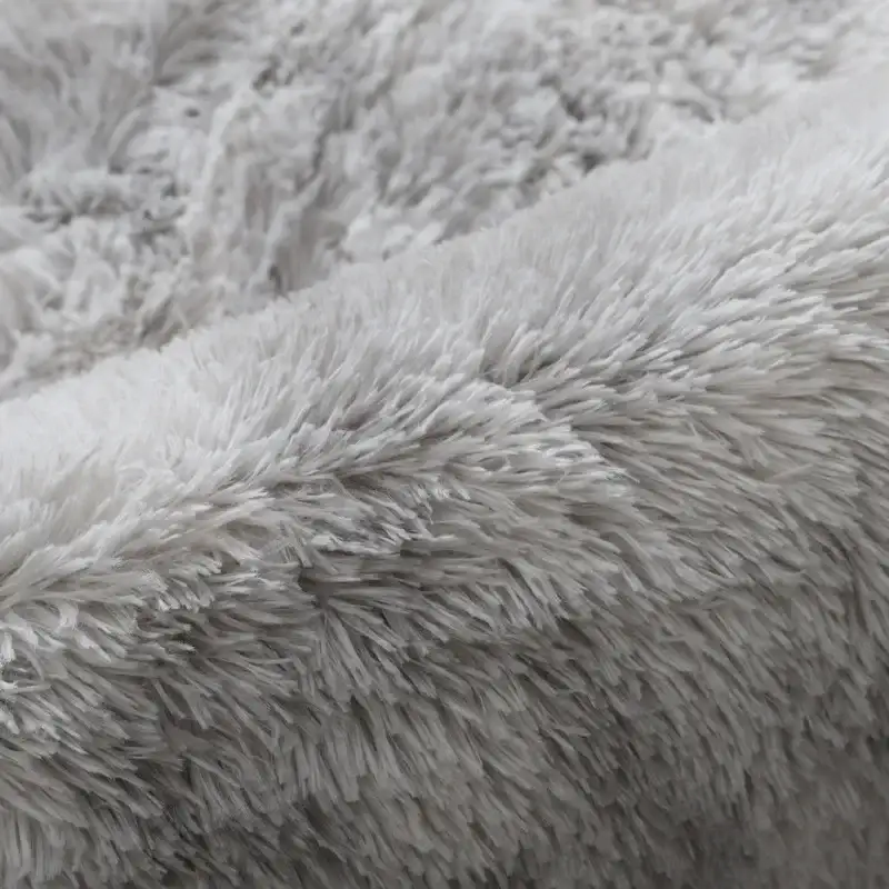Soft, gray, shaggy fabric.
