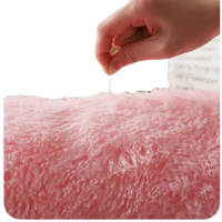 Soft pink shag rug.