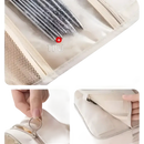 Beige hanging toiletry bag.