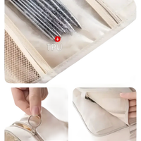 Beige hanging toiletry bag.