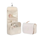 Beige hanging toiletry bag with dimensions.