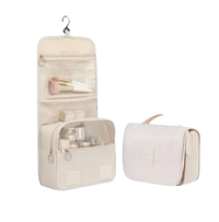 Beige hanging toiletry bag with dimensions.
