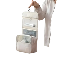 Hanging, multi-compartment toiletry bag.