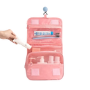 Pink hanging toiletry bag.